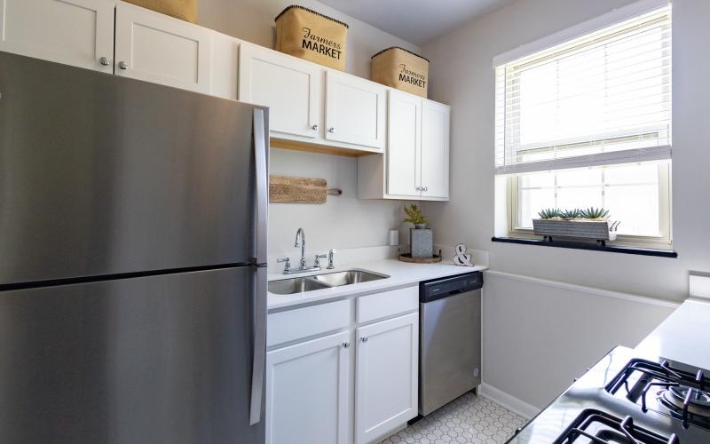 a kitchen with white cabinets