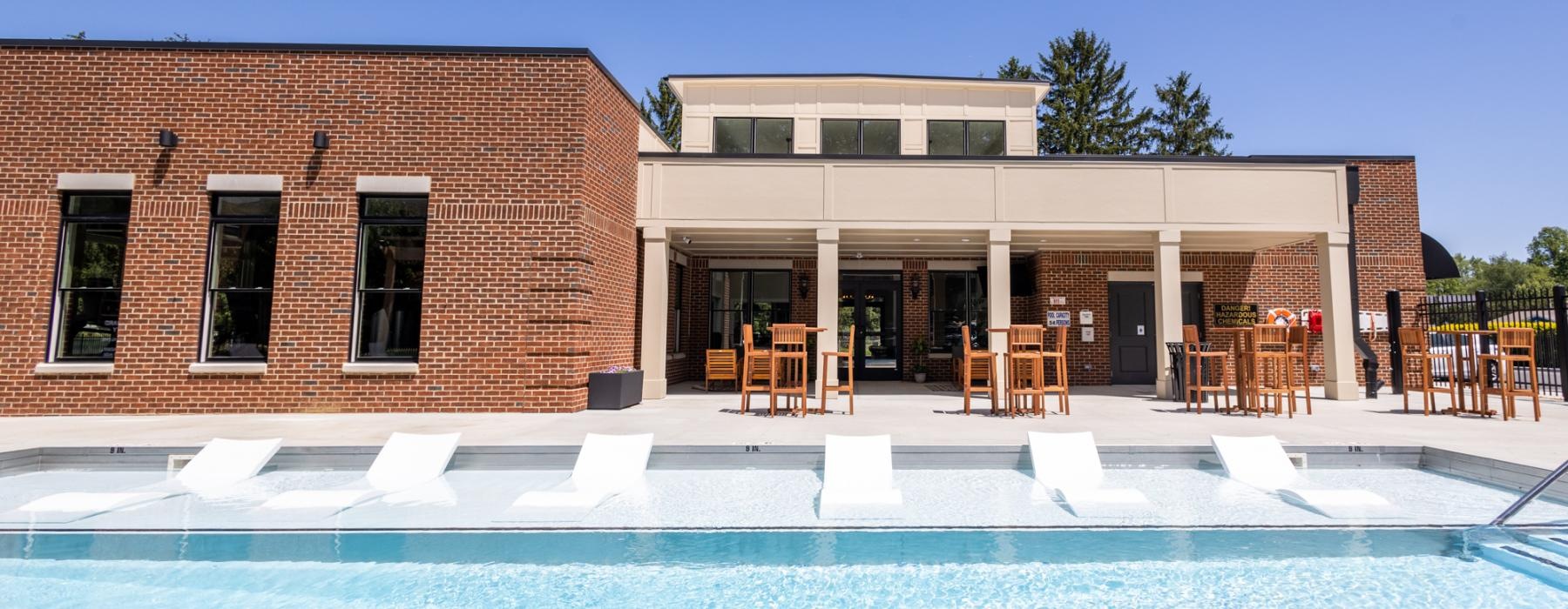 a swimming pool in front of a building